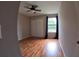 Bedroom featuring hardwood floors, a ceiling fan, closet, and plenty of natural light at 12241 Augusta Woods Cir, Orlando, FL 32824