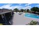 Community pool with lounge chairs for relaxing by the water at 12241 Augusta Woods Cir, Orlando, FL 32824