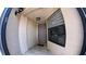 Inviting townhome front door with tile flooring and a large window offering interior views at 12241 Augusta Woods Cir, Orlando, FL 32824