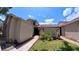 Charming townhome with a walkway leading to the entrance and beautifully manicured front yard at 12241 Augusta Woods Cir, Orlando, FL 32824