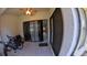 View of screened lanai with bicycle and tile floor at 12241 Augusta Woods Cir, Orlando, FL 32824