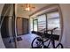 Enclosed lanai with tile floor, ceiling fan, sliding glass doors, and bicycles at 12241 Augusta Woods Cir, Orlando, FL 32824