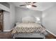 Bedroom with neutral walls, wood floors, and a ceiling fan for comfortable living at 125 Homewood Dr, Winter Haven, FL 33880
