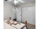 Bedroom with a ceiling fan, plush carpet, and closet with sliding doors at 125 Homewood Dr, Winter Haven, FL 33880