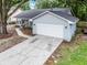 A charming home with a well-maintained driveway and a lovely facade at 125 Homewood Dr, Winter Haven, FL 33880