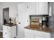 Kitchen featuring granite countertops, modern appliances, and stylish cabinetry for ample storage at 125 Homewood Dr, Winter Haven, FL 33880