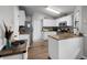 Modern kitchen with granite countertops, stainless steel appliances, and ample cabinet space at 125 Homewood Dr, Winter Haven, FL 33880