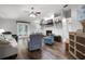 Bright living room featuring a fireplace, a ceiling fan, and hardwood floors at 125 Homewood Dr, Winter Haven, FL 33880