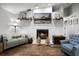 Comfortable living room showcasing a fireplace, stylish decor, and hardwood floors at 125 Homewood Dr, Winter Haven, FL 33880