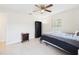 Bedroom with a ceiling fan, closet, and good natural light at 14191 Se 25Th Ave, Summerfield, FL 34491