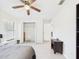 Bright bedroom featuring tile floors and closet with organizers at 14191 Se 25Th Ave, Summerfield, FL 34491