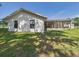 Exterior: Bright house has a screened-in porch and beautiful backyard at 14191 Se 25Th Ave, Summerfield, FL 34491