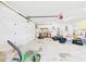 Clean and organized two-car garage with ample storage space and potential for workshop at 14191 Se 25Th Ave, Summerfield, FL 34491