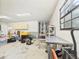 Spacious two-car garage features a work bench, storage, and abundant natural light at 14191 Se 25Th Ave, Summerfield, FL 34491