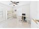Bright home office features white walls, windows, and desk at 14191 Se 25Th Ave, Summerfield, FL 34491