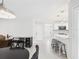 Bright kitchen with sleek white cabinets, modern appliances, and a peninsula with barstool seating at 14191 Se 25Th Ave, Summerfield, FL 34491