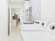 Bright laundry room with white cabinets, modern sink, and washer/dryer units at 14191 Se 25Th Ave, Summerfield, FL 34491