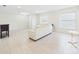 Spacious living room with neutral walls, tile floor, and natural light at 14191 Se 25Th Ave, Summerfield, FL 34491