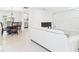 Open concept living room with adjacent dining area and stainless steel kitchen at 14191 Se 25Th Ave, Summerfield, FL 34491