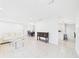 Bright and airy living room featuring tiled floors and modern furniture at 14191 Se 25Th Ave, Summerfield, FL 34491