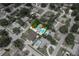 Aerial view of the property, displaying the home, pool, and surrounding neighborhood at 1491 Avenue F Ne, Winter Haven, FL 33881