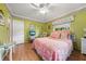 Inviting bedroom with light green walls, and comfortable furnishings at 1491 Avenue F Ne, Winter Haven, FL 33881