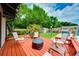 Relaxing deck area with seating provides a cozy spot for outdoor gatherings at 1491 Avenue F Ne, Winter Haven, FL 33881