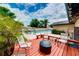 Spacious wooden deck features comfortable seating, perfect for enjoying the outdoors at 1491 Avenue F Ne, Winter Haven, FL 33881