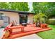 Cozy deck area offers outdoor seating and a fire pit, ideal for entertaining at 1491 Avenue F Ne, Winter Haven, FL 33881