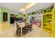 Eat-in kitchen and table with view into living room at 1491 Avenue F Ne, Winter Haven, FL 33881