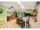 Bright dining area with tile flooring, access to Gathering room, and natural light at 1491 Avenue F Ne, Winter Haven, FL 33881