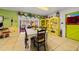 Eat-in kitchen features tiled floor, decorative shelving and quirky furnishings at 1491 Avenue F Ne, Winter Haven, FL 33881