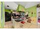 Eat-in kitchen features breakfast bar seating and access to the living area at 1491 Avenue F Ne, Winter Haven, FL 33881