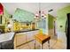View of colorful kitchen with a unique island countertop and lots of room to cook at 1491 Avenue F Ne, Winter Haven, FL 33881