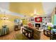 Bright living room with colorful decor, fireplace, built-in bookshelves, and hardwood floors at 1491 Avenue F Ne, Winter Haven, FL 33881