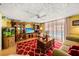 A bright living room with TV, ceiling fan and view of the pool at 1491 Avenue F Ne, Winter Haven, FL 33881