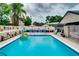 Bright blue pool and fun float invite you to cool off and enjoy the outdoor living space at 1491 Avenue F Ne, Winter Haven, FL 33881