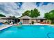 Backyard pool with a fun inflatable, the house, and an outdoor space perfect for summer enjoyment at 1491 Avenue F Ne, Winter Haven, FL 33881
