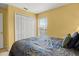Bedroom featuring a comfortable bed, closet, and a window providing natural light at 151 Hideaway Beach Ln, Kissimmee, FL 34746