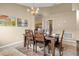 Lovely dining room with neutral walls, stylish lighting, and a beautiful dining set at 151 Hideaway Beach Ln, Kissimmee, FL 34746