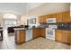 Well-lit kitchen with oak cabinets and ample counter space at 151 Hideaway Beach Ln, Kissimmee, FL 34746