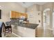Open kitchen featuring granite countertops and breakfast bar at 151 Hideaway Beach Ln, Kissimmee, FL 34746