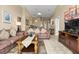 Spacious living room with neutral color palette, tile floors, and comfortable couches at 151 Hideaway Beach Ln, Kissimmee, FL 34746