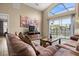 Spacious living room with lots of natural light and pool views at 151 Hideaway Beach Ln, Kissimmee, FL 34746