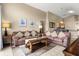 Bright living room featuring couches, tile flooring, and neutral wall colors at 151 Hideaway Beach Ln, Kissimmee, FL 34746
