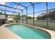 Screened pool with clear blue water, surrounded by ample seating, and neighborhood views at 151 Hideaway Beach Ln, Kissimmee, FL 34746