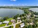 Lake Cannon home boasts landscaped yard and waterfront access, perfect for enjoying serene lake views at 1540 N Lake Mirror Nw Dr, Winter Haven, FL 33881