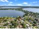 Stunning aerial view of waterfront homes nestled along two beautiful, large lakes, showcasing a serene and picturesque setting at 1540 N Lake Mirror Nw Dr, Winter Haven, FL 33881