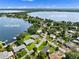 Overhead shot of Lake Howard neighborhood, showcasing waterfront homes, lush greenery, and stunning lake views at 1540 N Lake Mirror Nw Dr, Winter Haven, FL 33881