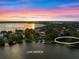 Beautiful view of lakes Cannon and Mirror; lot available for building, with serene lake views at 1540 N Lake Mirror Nw Dr, Winter Haven, FL 33881